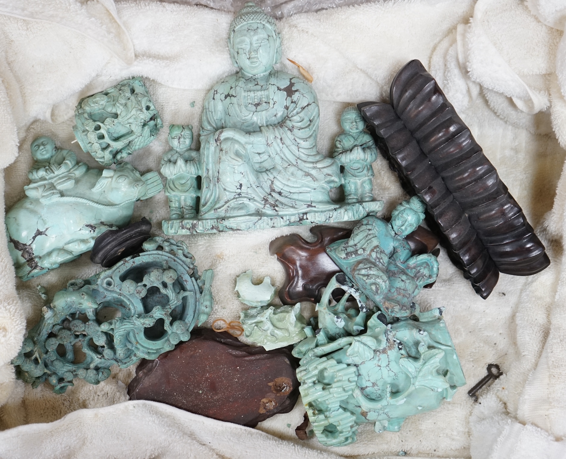 A group of Chinese turquoise matrix carvings, comprising a boy on a buffalo, 5.5in. a brushwasher, 7in. a vase and cover, 6.5in. a snuff bottle and a figure of a woman, 4.5in. (all a.f.)